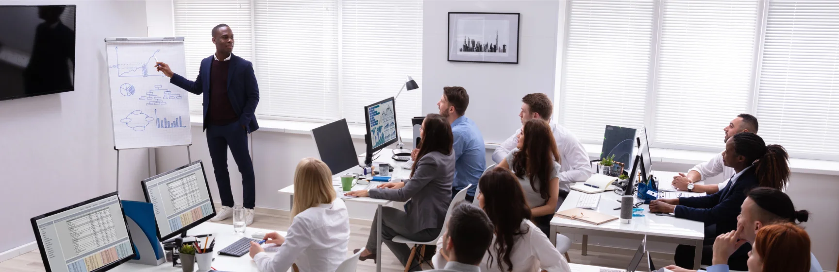 Instructional design consulting team developing custom training programs for corporate clients