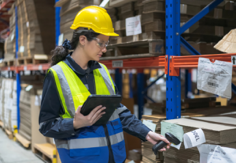 warehouse worker scanning inventory to support clean data and procurement systems alignment