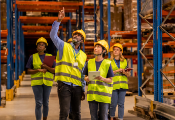 supply chain leadership and frontline team aligning on warehouse performance goals