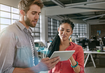 small business consultant reviewing priorities and customer commitments with operations manager