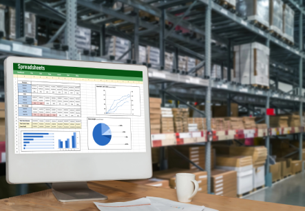 spreadsheet on a warehouse computer monitor showing the cost impact of unresolved warehouse inefficiencies