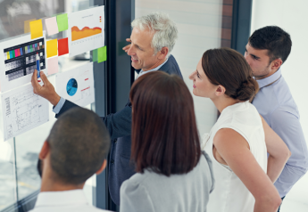 business team reviewing performance metrics during transformation consulting engagement