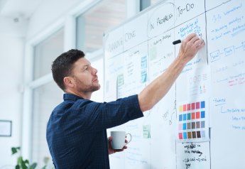 consultant mapping business process redesign on whiteboard
