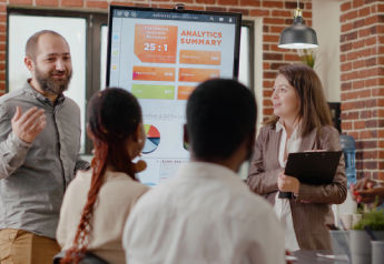 change management consultant reviewing adoption metrics and process performance with team