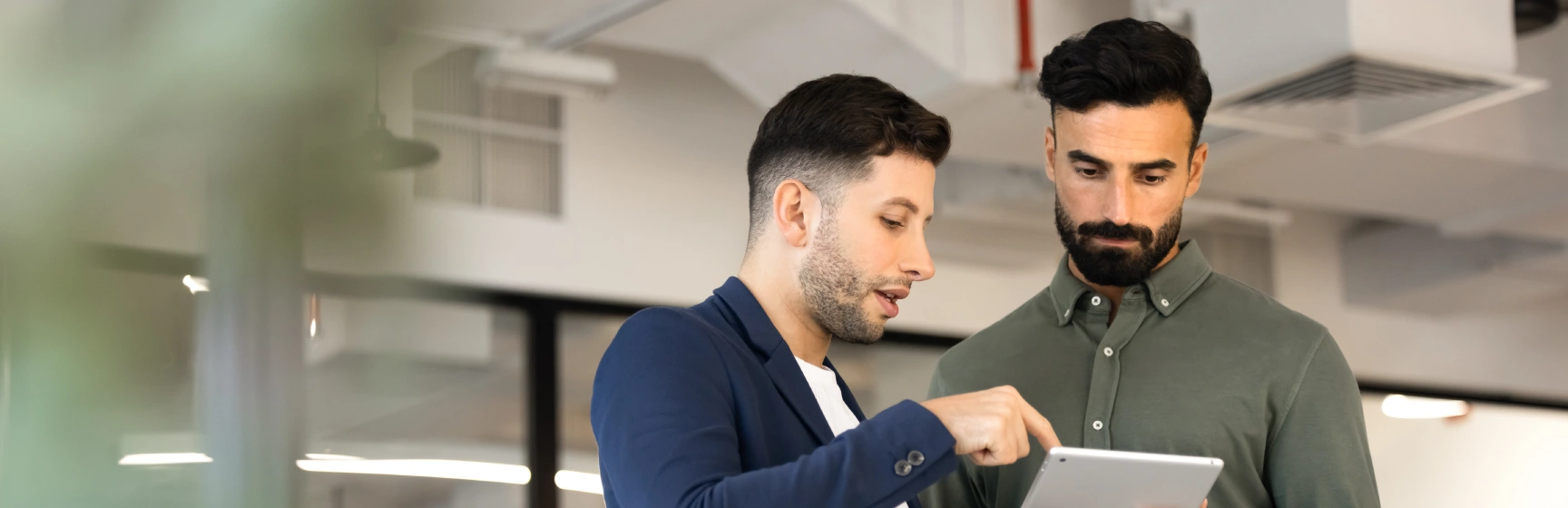 Two business professionals reviewing document management consulting services
