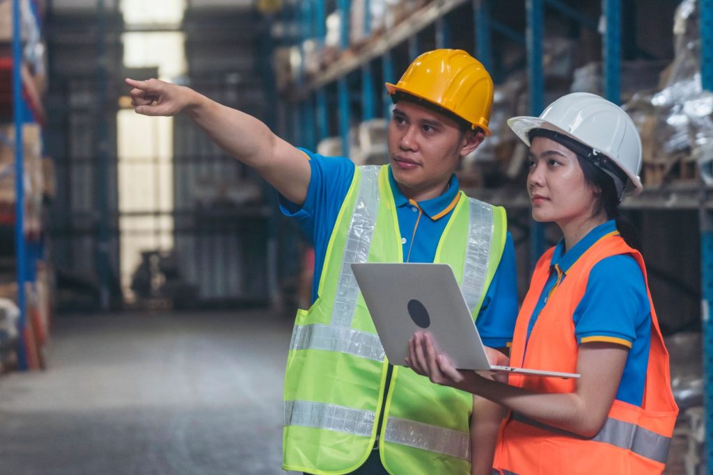 Warehouse operations team reviewing inventory accuracy process on facility floor