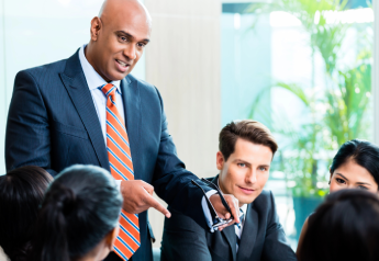 business leader presenting document management SOP training and adoption plan to a team