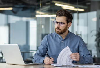 consultant reviewing completed requirements document contents and system dependency documentation