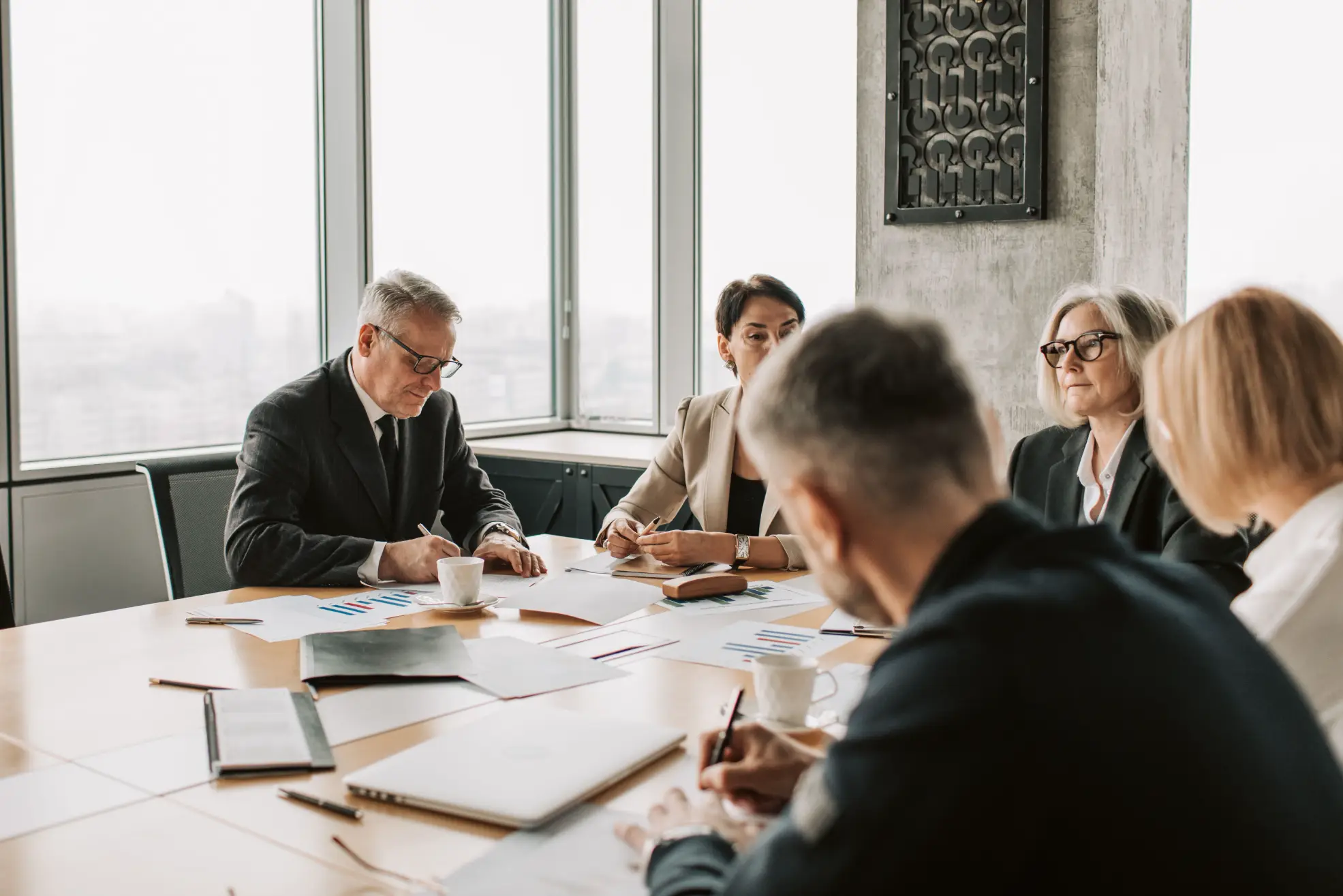 Business team at conference table discussing integrated business planning